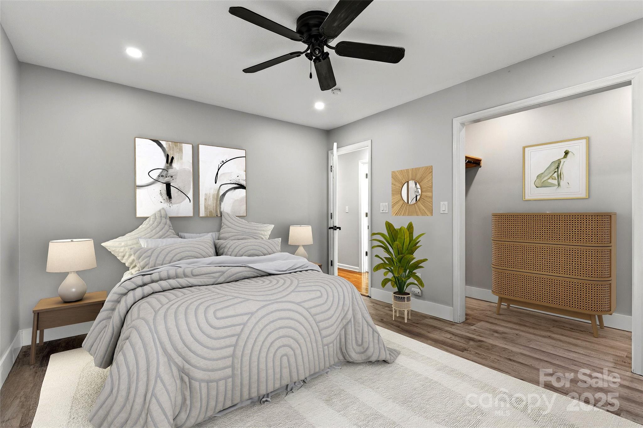 86 Springdale Drive Marion, NC 28752 - Photo 28 of 40 a bedroom with a bed and a chandelier