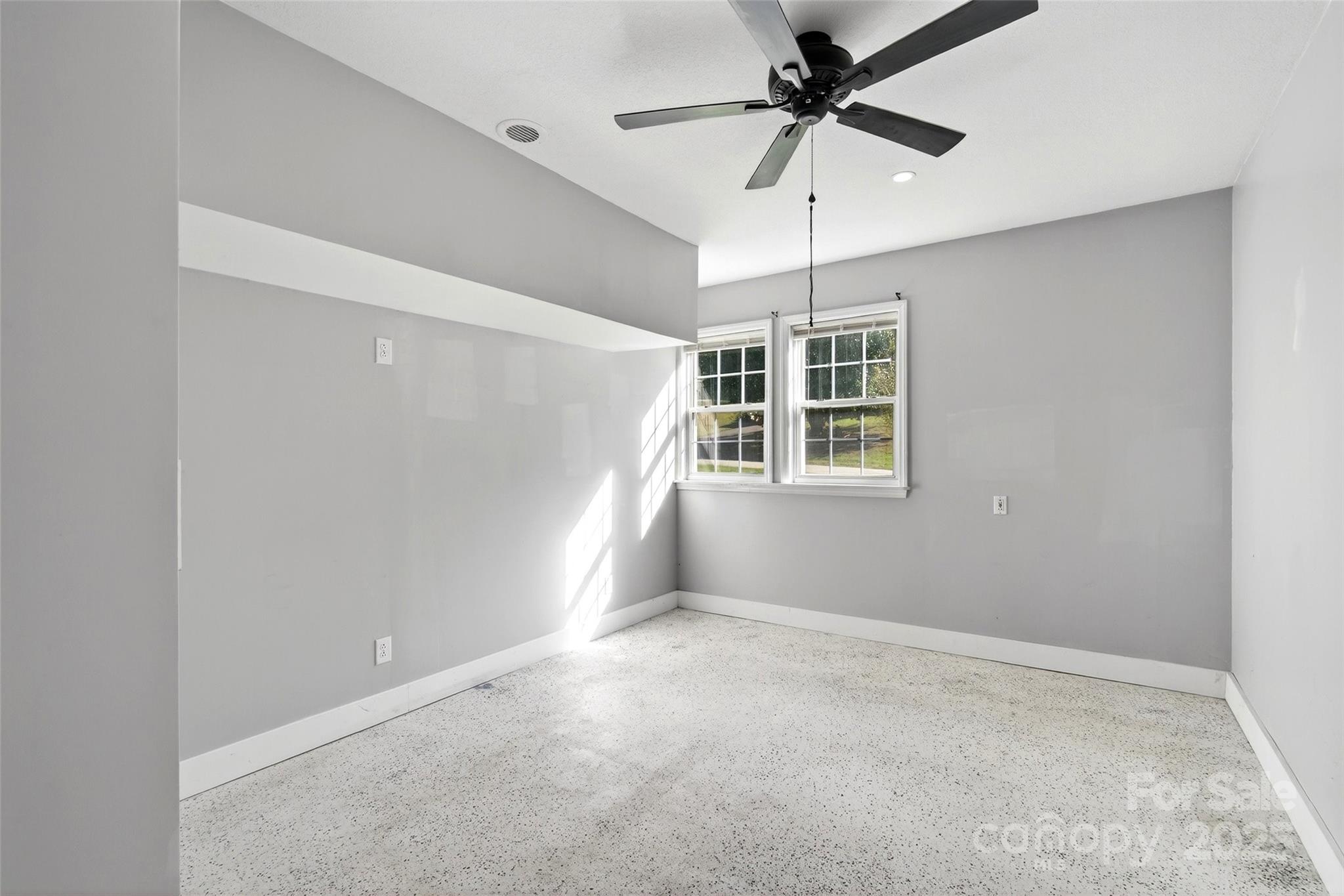 86 Springdale Drive Marion, NC 28752 - Photo 34 of 40 a view of a livingroom with a ceiling fan and window