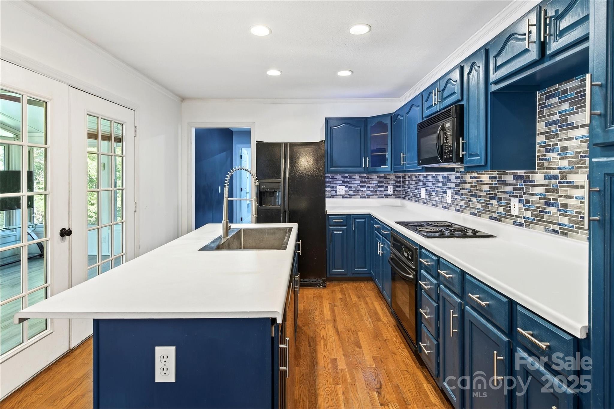 86 Springdale Drive Marion, NC 28752 - Photo 10 of 40 a kitchen with stainless steel appliances kitchen island a sink stove and refrigerator