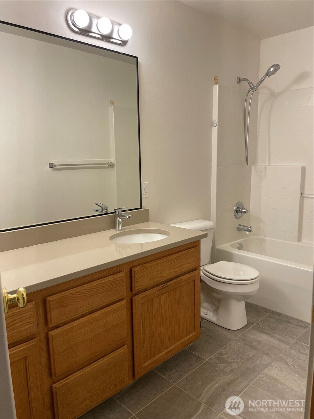 15409 51st Place West Edmonds, WA 98026 - Photo 11 of 14 a bathroom with a toilet a sink a mirror and bathtub