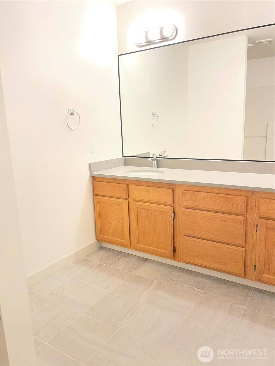 15409 51st Place West Edmonds, WA 98026 - Photo 12 of 14 a bathroom with a sink and a mirror