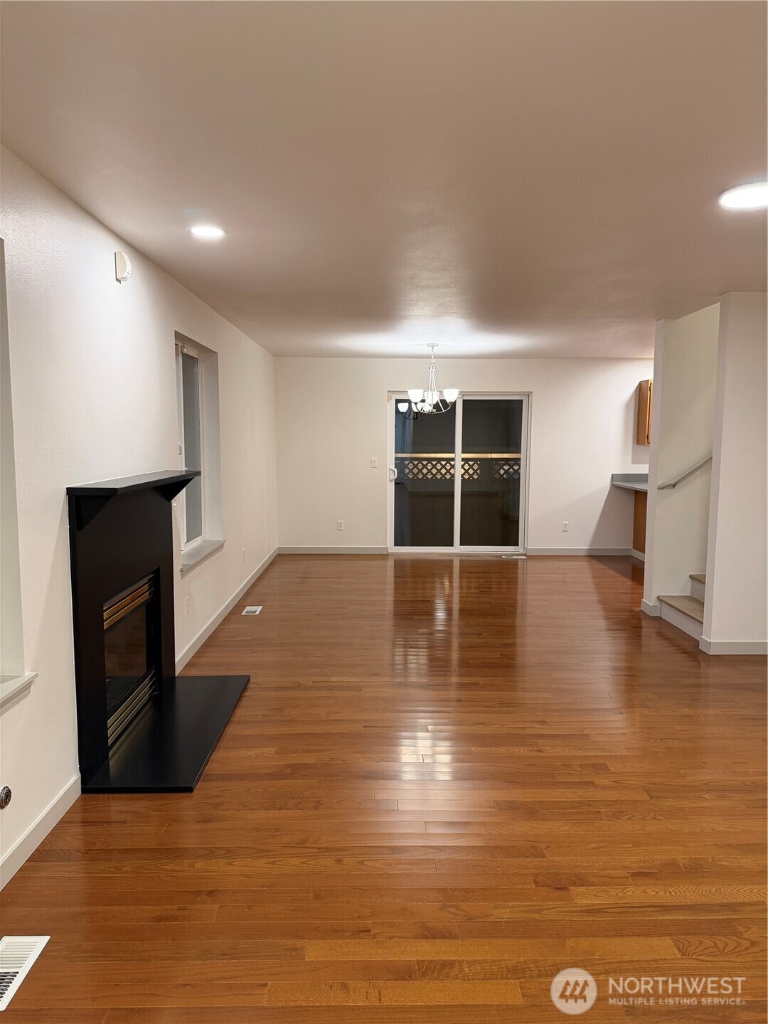 15409 51st Place West Edmonds, WA 98026 - Photo 2 of 14 a view of empty room with wooden floor and fireplace