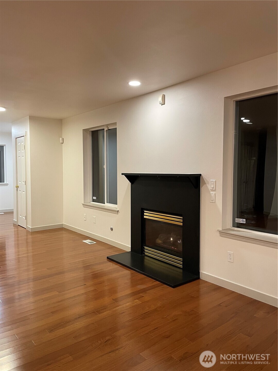15409 51st Place West Edmonds, WA 98026 - Photo 3 of 14 a view of an empty room with a fireplace and a window