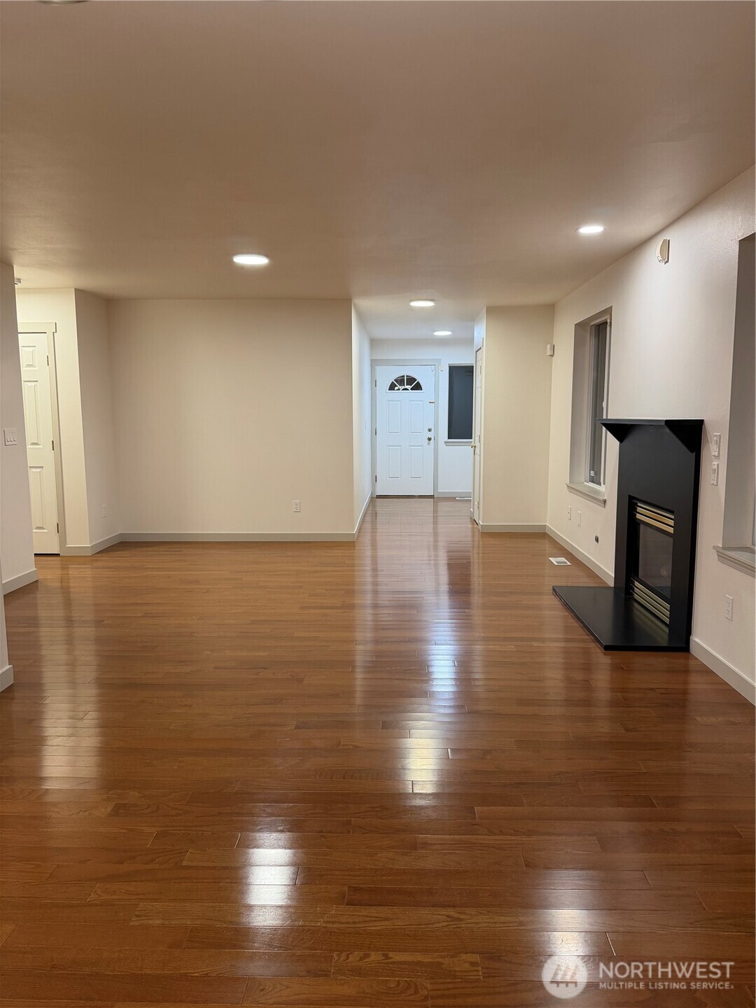 15409 51st Place West Edmonds, WA 98026 - Photo 7 of 14 a view of an empty room with wooden floor