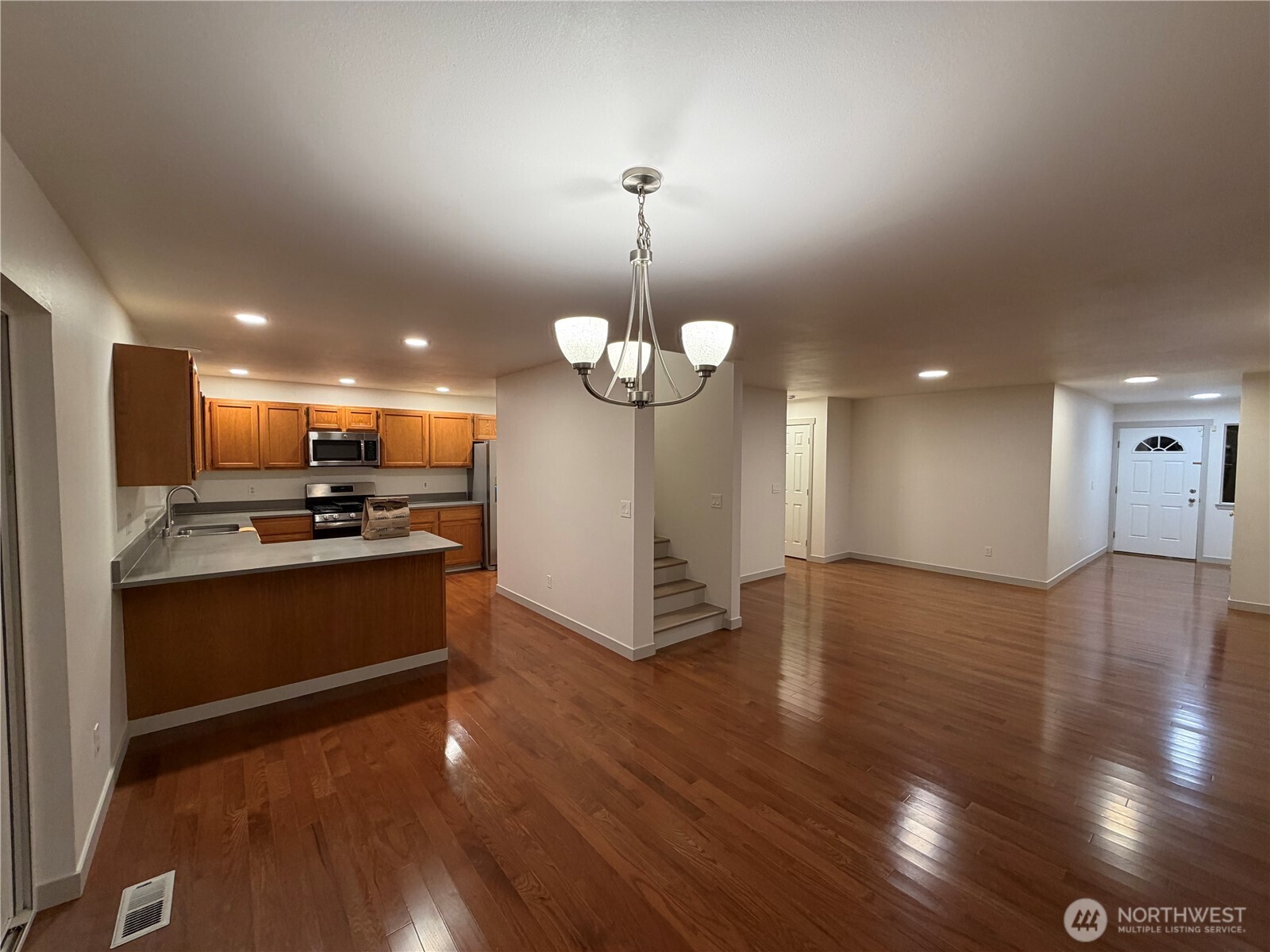 15409 51st Place West Edmonds, WA 98026 - Photo 9 of 14 a kitchen with stainless steel appliances granite countertop a stove refrigerator and a sink