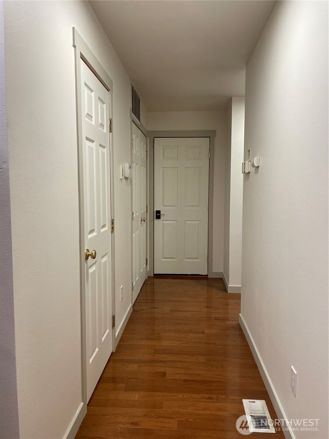 15409 51st Place West Edmonds, WA 98026 - Photo 10 of 14 a view of a hallway with wooden floor