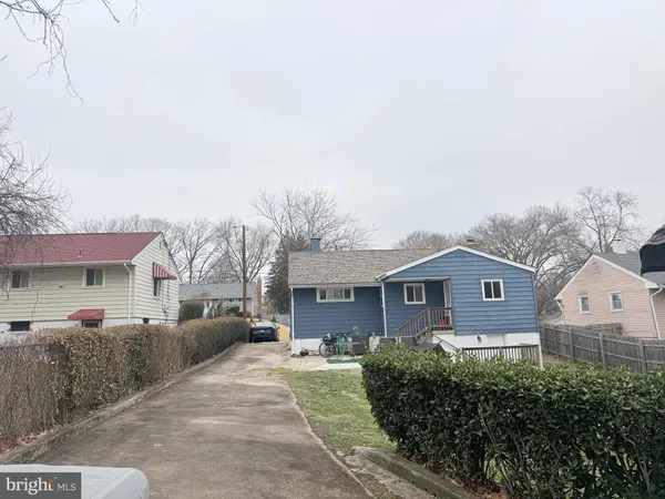 a aerial view of a house with a yard and garage