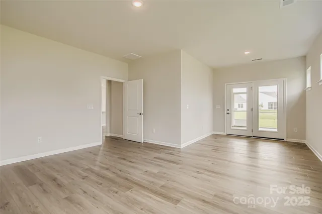 a bathroom with double sink and a mirror