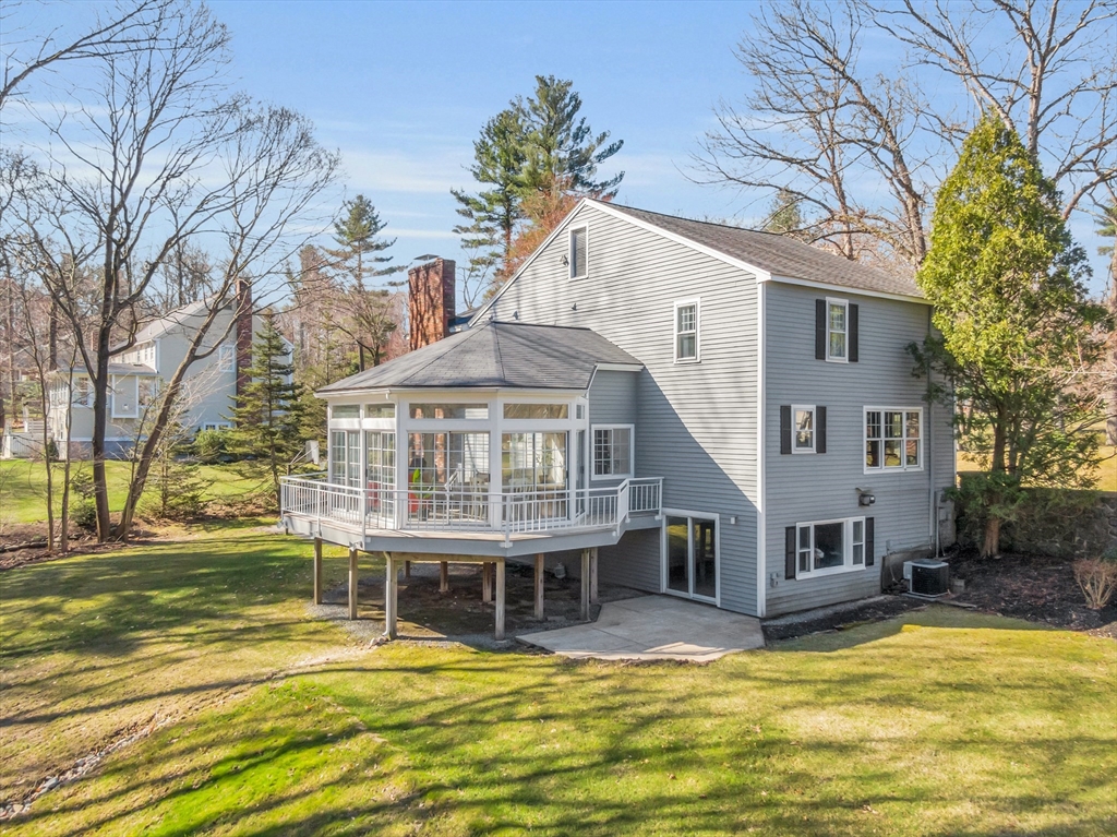 18 Greybirch Road Andover, MA 01810 - Photo 3 of 42 a view of a house with a large pool and sitting area