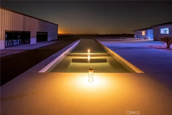 a view of swimming pool from a balcony