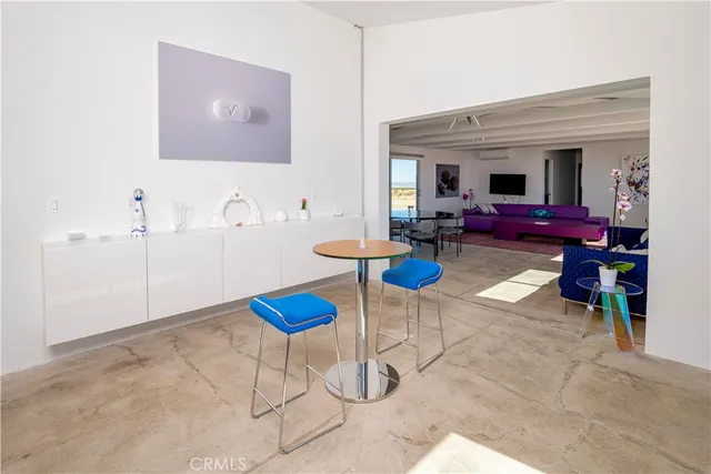 a kitchen with granite countertop a refrigerator stove top oven and sink