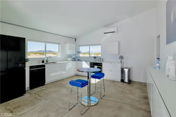 a kitchen with a sink stove and refrigerator