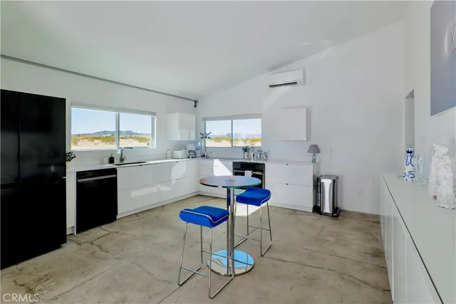 a kitchen with a sink stove and refrigerator