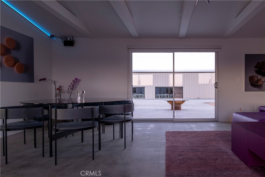 60810 Cole Lane Landers, CA 92285 - Photo 16 of 51 a living room with furniture a table and a large window