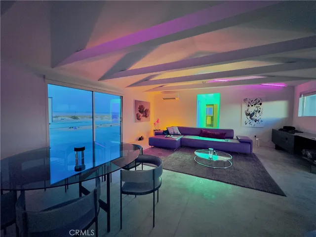 a view of an chairs and table in an empty room