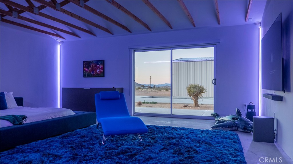 60810 Cole Lane Landers, CA 92285 - Photo 22 of 51 a bedroom with a bed and wooden floor