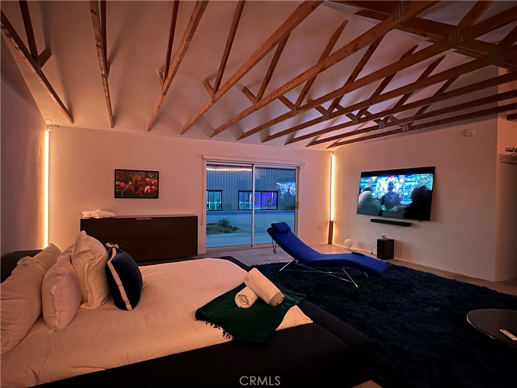 60810 Cole Lane Landers, CA 92285 - Photo 23 of 51 a bedroom with furniture and a flat screen tv