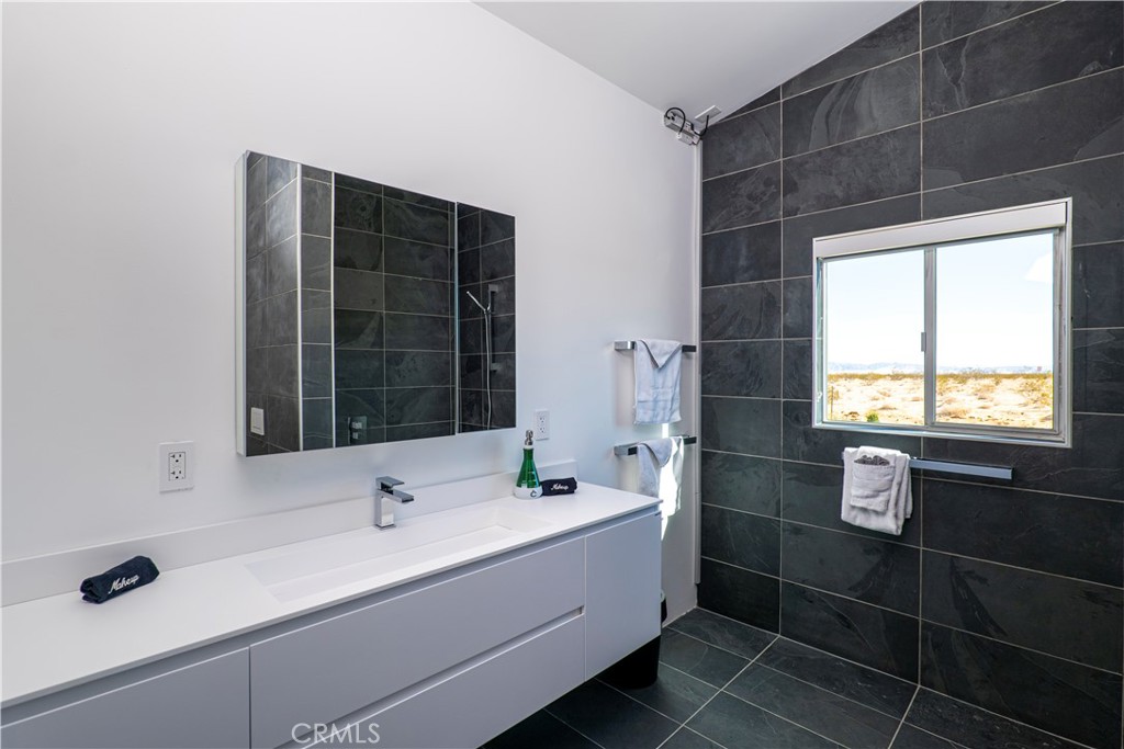 60810 Cole Lane Landers, CA 92285 - Photo 25 of 51 a bathroom with a sink and a mirror
