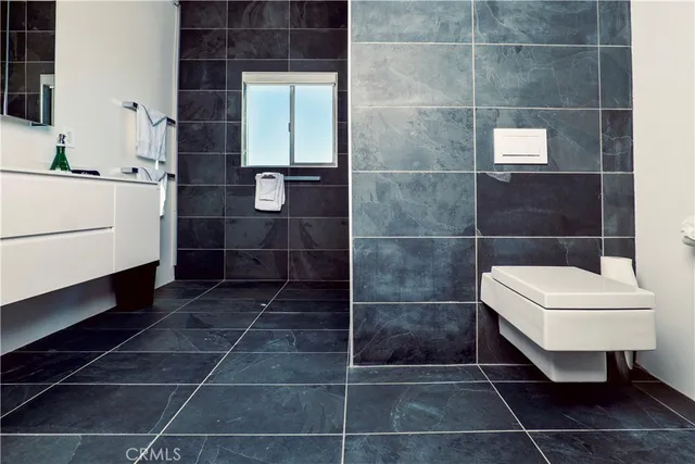 a bathroom with a toilet and shower