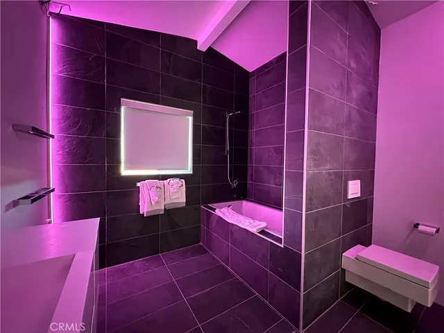 a bathroom with a double vanity sink and mirror