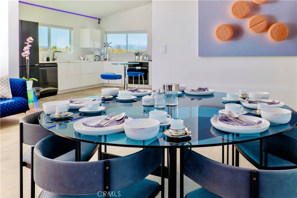 60810 Cole Lane Landers, CA 92285 - Photo 3 of 51 a view of a dining room with furniture and wooden floor