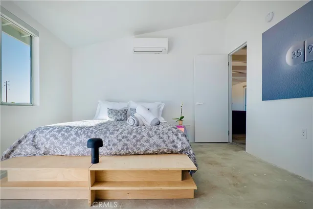 a bed room with a bed and a night stand