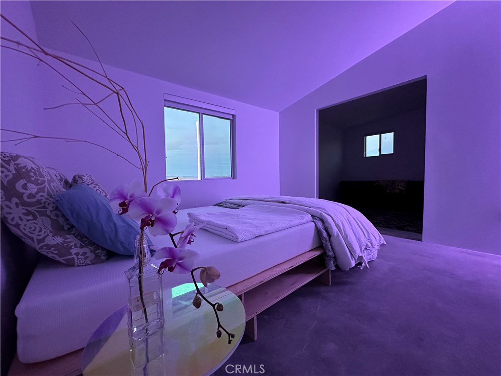 60810 Cole Lane Landers, CA 92285 - Photo 37 of 51 a bed room with a bed and a night stand