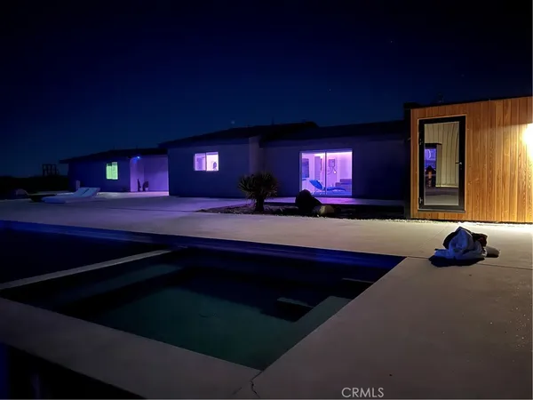 a view of swimming pool with outdoor seating