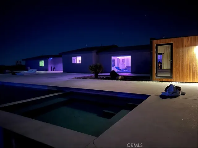 a view of swimming pool with outdoor seating