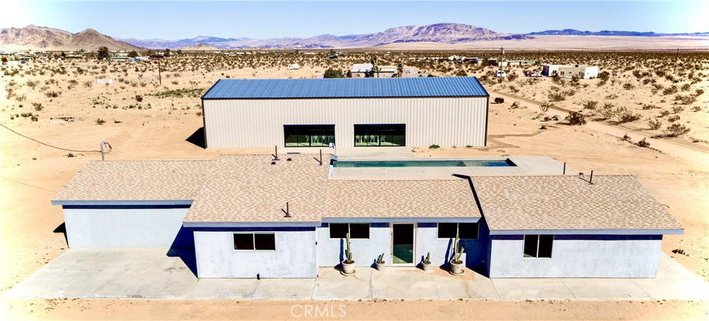 60810 Cole Lane Landers, CA 92285 - Photo 8 of 51 a view of a house with a terrace