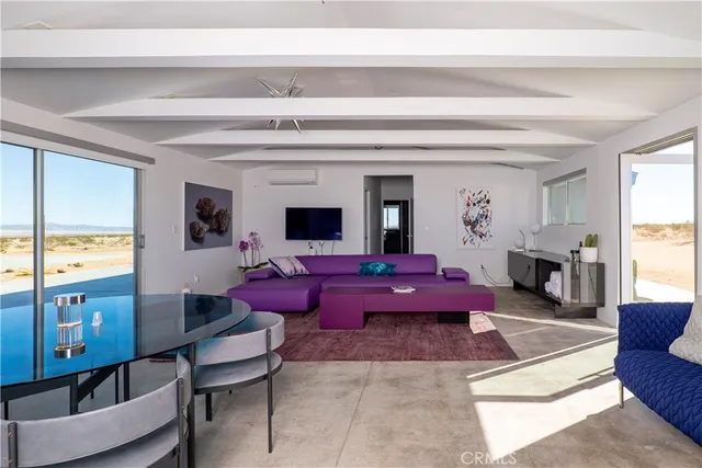 a view of swimming pool with a table and chairs