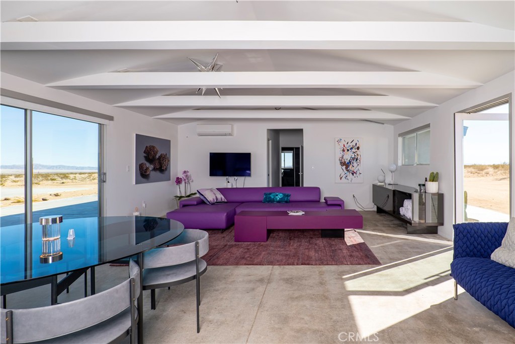 60810 Cole Lane Landers, CA 92285 - Photo 10 of 51 a living room with furniture or chandelier and a dining table