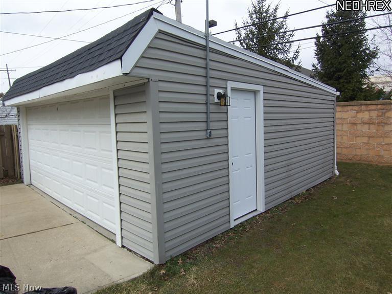 4089 Bushnell Road University Heights, OH 44121 - Photo 23 of 25 Brand new 6 panel service door into garage.
