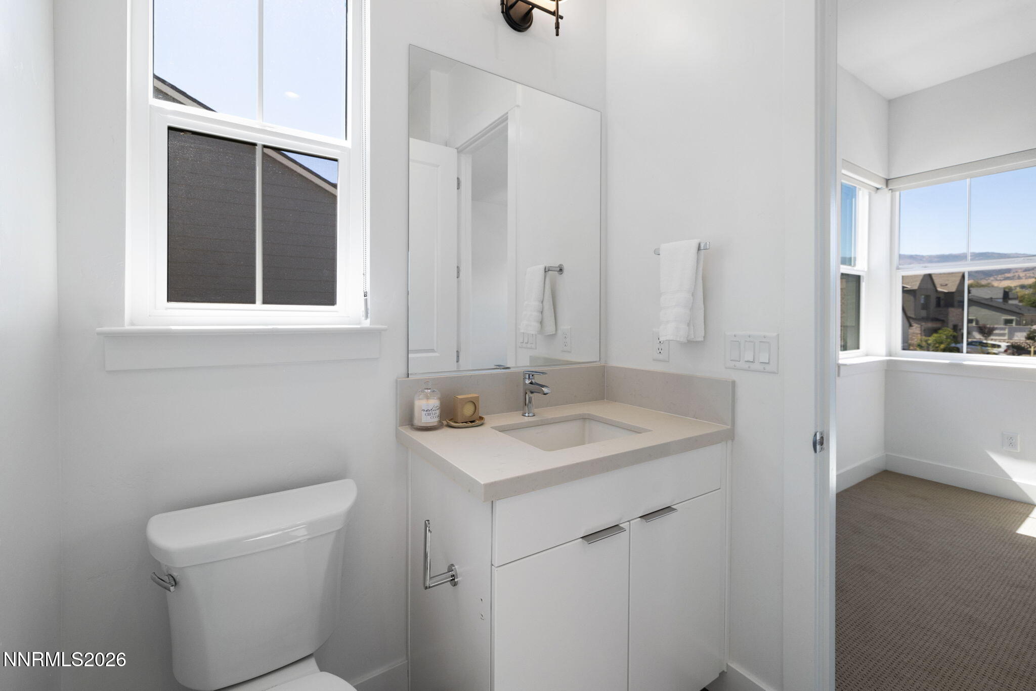 5406 Side Saddle Trail Reno, NV 89511 - Photo 28 of 39 a bathroom with a sink toilet and window