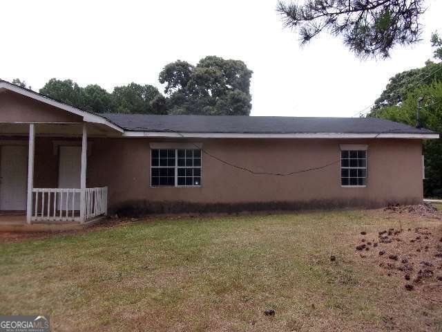 1759 Teamon Road, Unit B Griffin, GA 30223 - Photo 1 of 10 a front view of a house with a garden