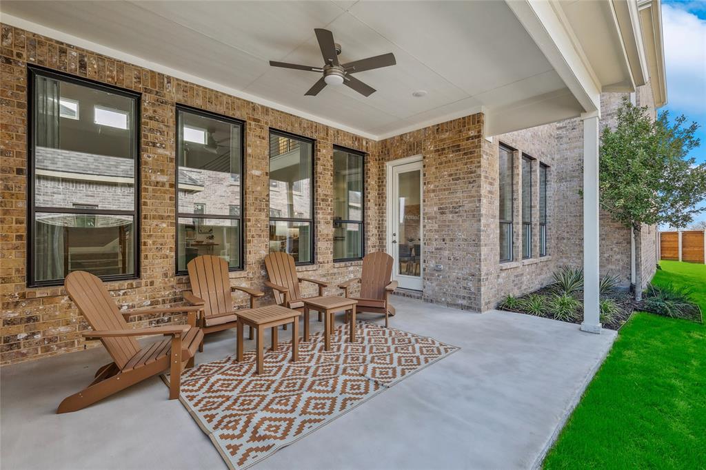 1604 Casting Ridge Mesquite, TX 75181 - Photo 36 of 38 Covered patio featuring a ceiling fan, brick exterior, multiple windows, and a glass-paned door