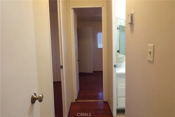 a view of a bathroom from a hallway