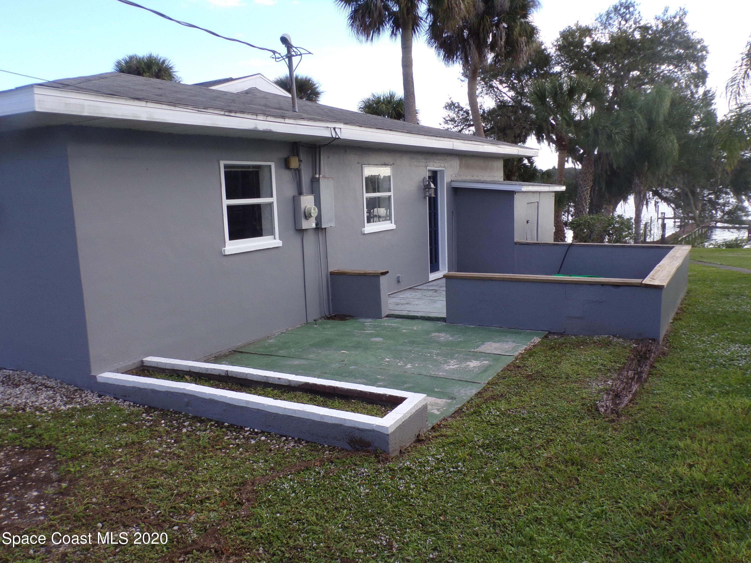 9900 Riverview Drive Micco, FL 32976 - Photo 3 of 15 SOUTH SIDE