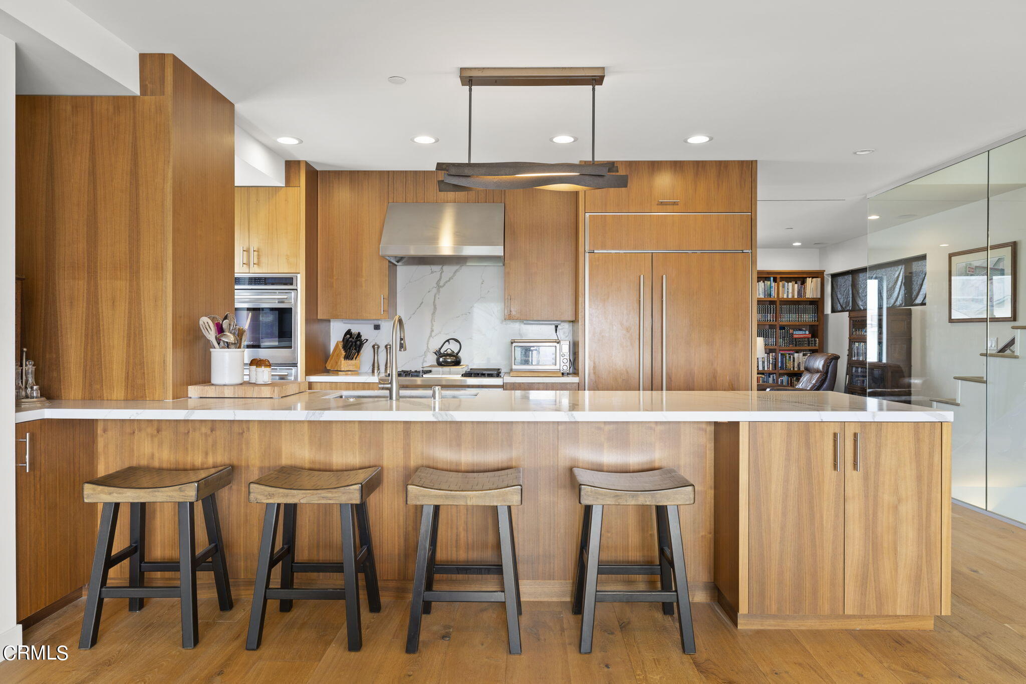 124 Ocean Drive Oxnard, CA 93035 - Photo 11 of 53 a kitchen with counter space and chairs in it