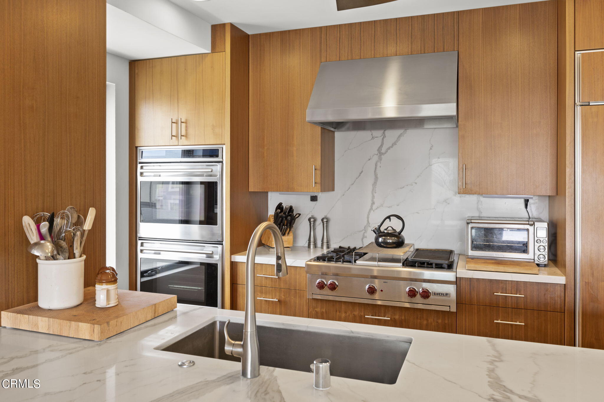 124 Ocean Drive Oxnard, CA 93035 - Photo 13 of 53 a kitchen with a stove and a refrigerator