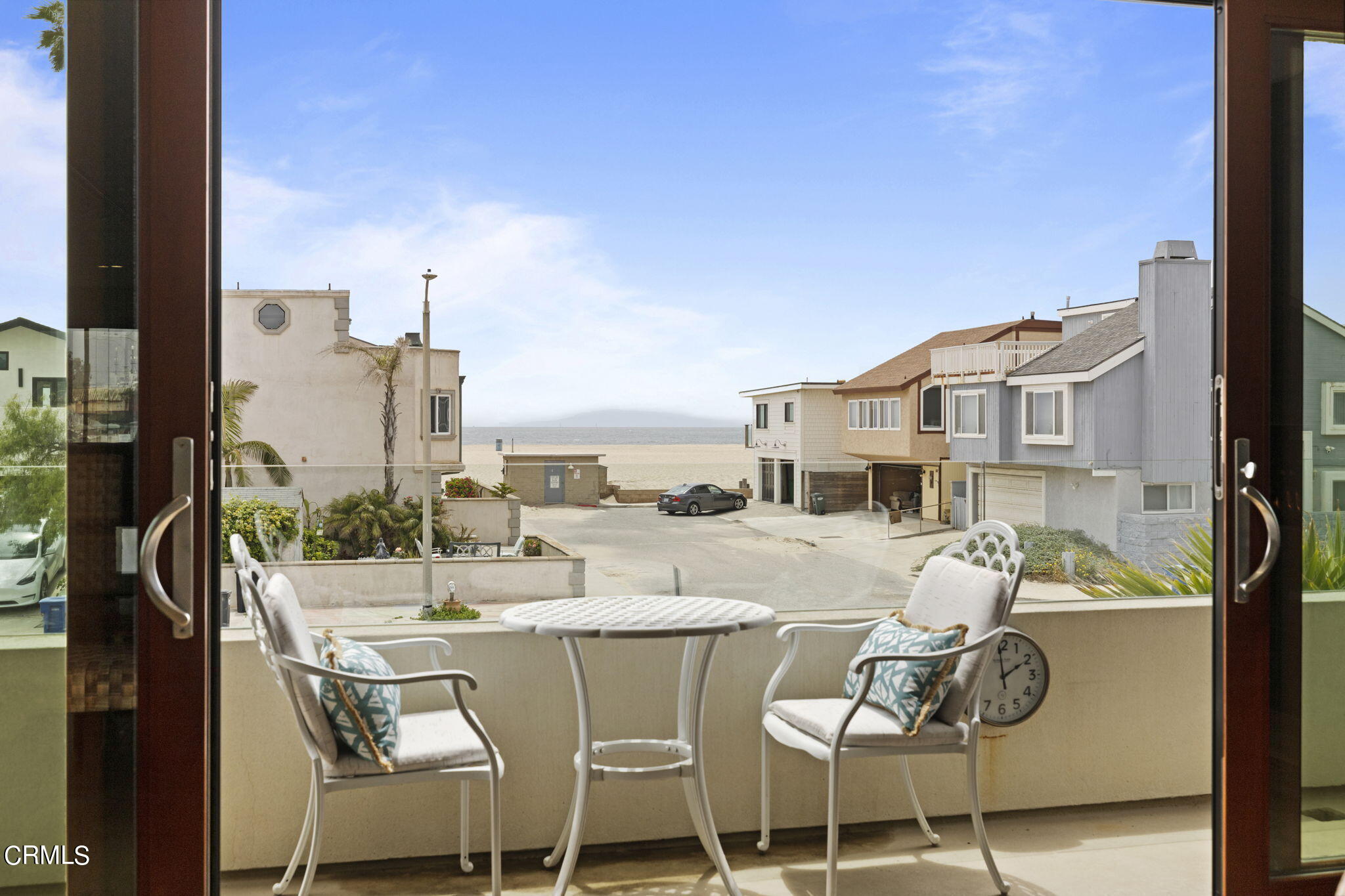 124 Ocean Drive Oxnard, CA 93035 - Photo 16 of 53 a dining room with furniture and a floor to ceiling window