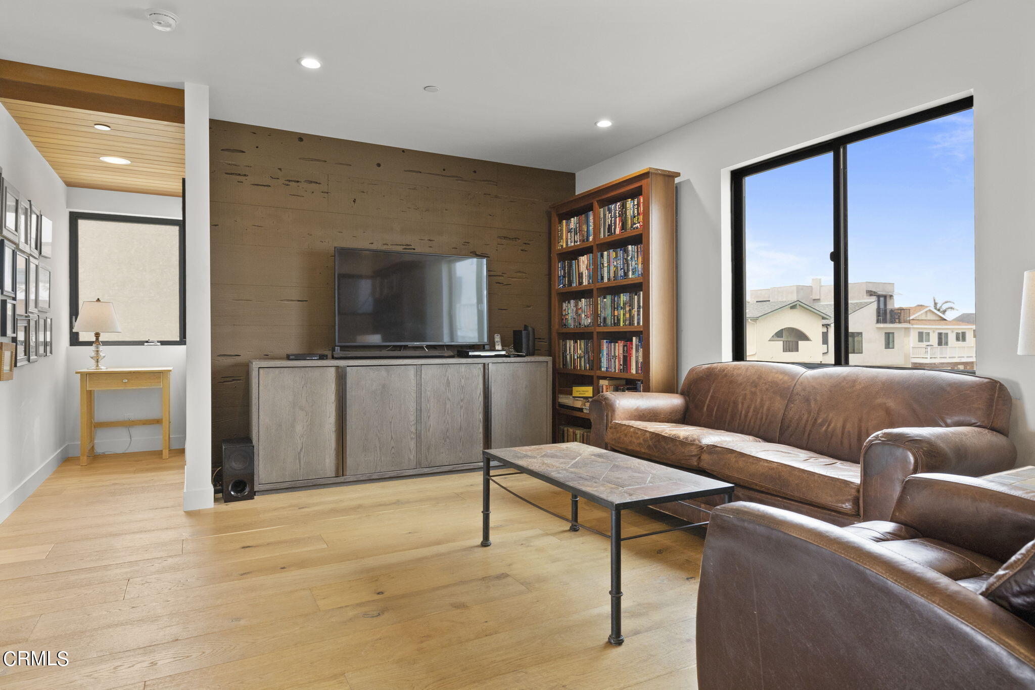 124 Ocean Drive Oxnard, CA 93035 - Photo 19 of 53 a living room with furniture and a flat screen tv