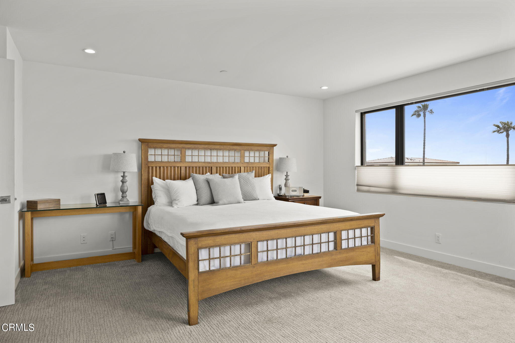 124 Ocean Drive Oxnard, CA 93035 - Photo 23 of 53 a bed sitting in a bedroom next to a lamp