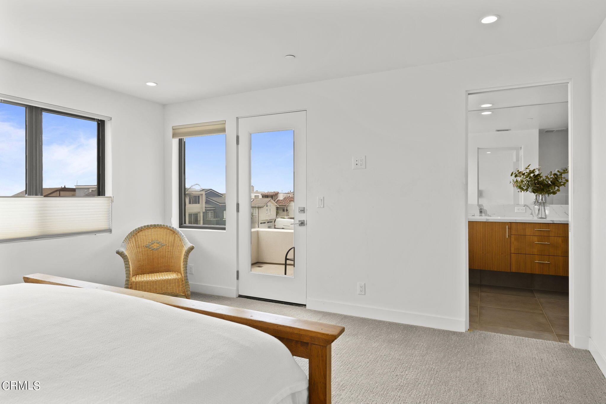 124 Ocean Drive Oxnard, CA 93035 - Photo 25 of 53 a bedroom with a bed and a chair