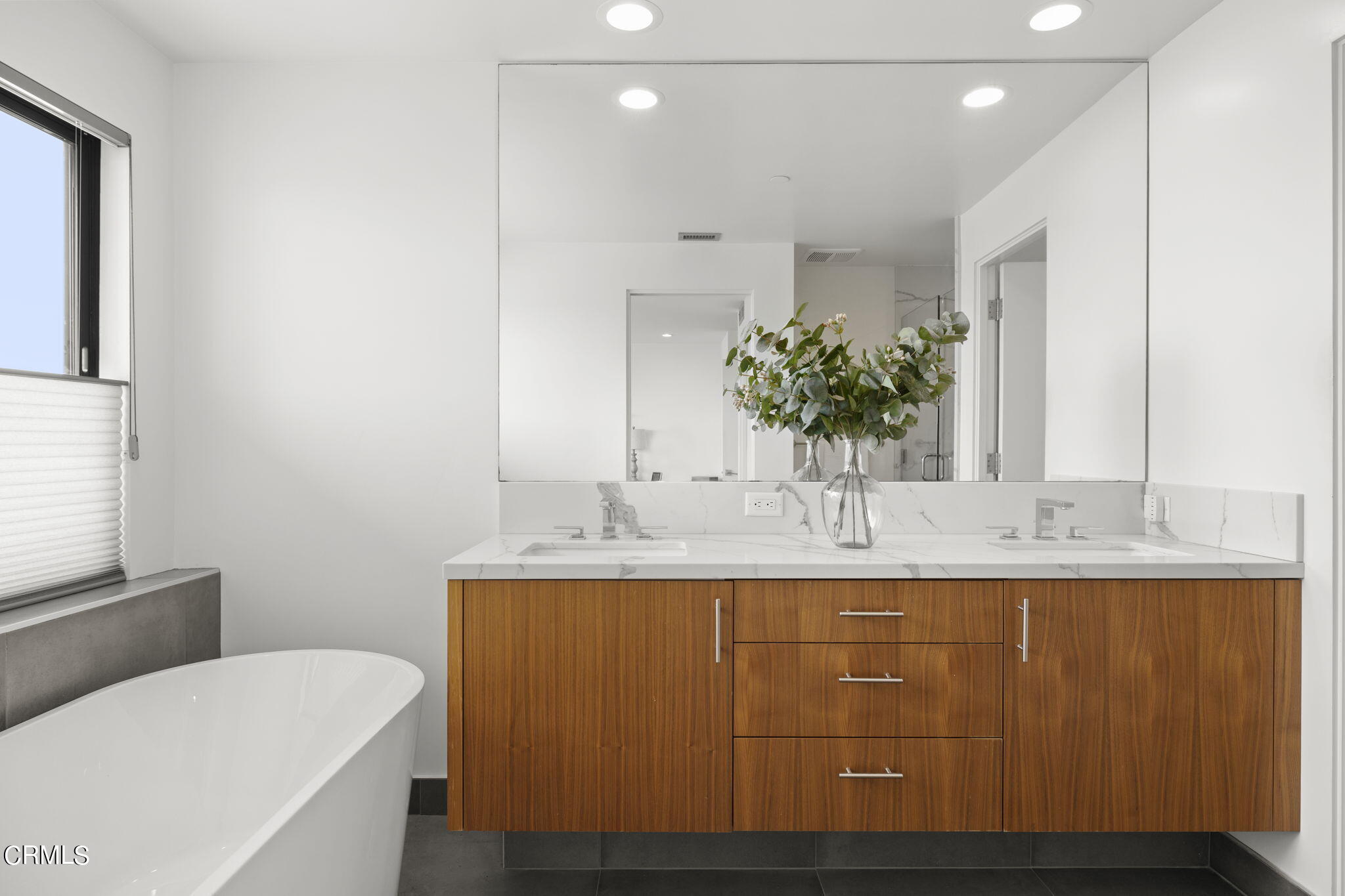 124 Ocean Drive Oxnard, CA 93035 - Photo 28 of 53 a bathroom with a sink and a mirror