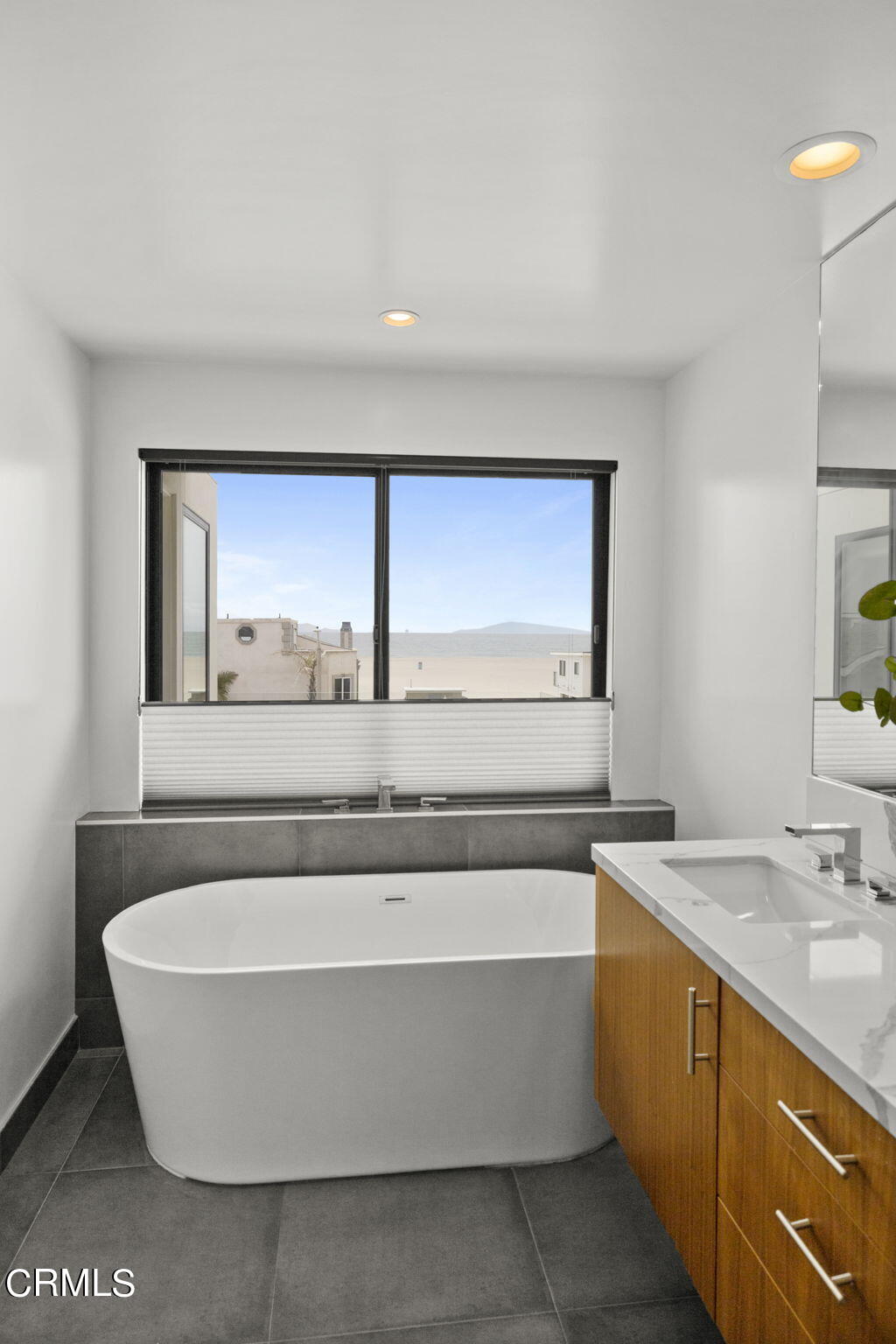 124 Ocean Drive Oxnard, CA 93035 - Photo 30 of 53 a bathroom with a bathtub and a sink