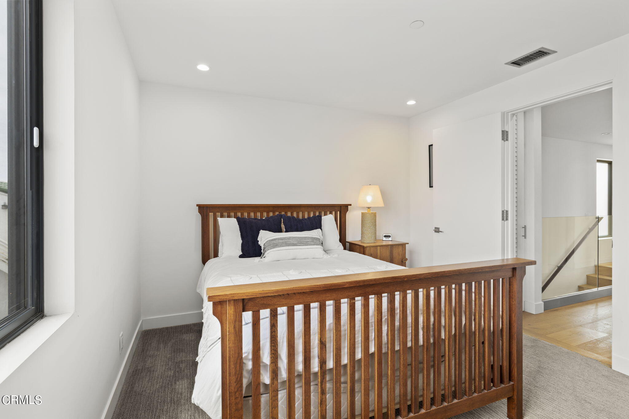 124 Ocean Drive Oxnard, CA 93035 - Photo 37 of 53 a bedroom with a bed and a window