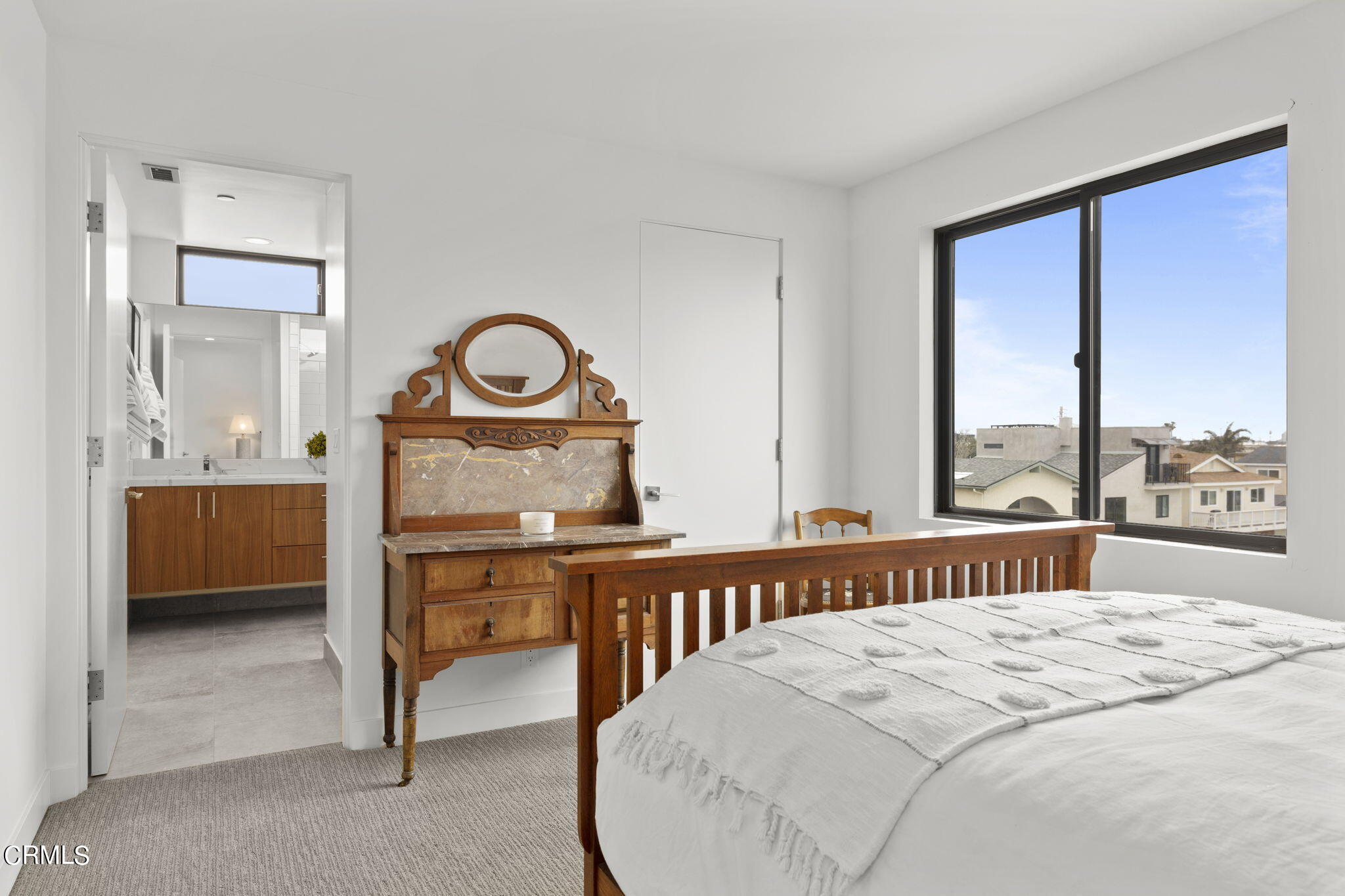 124 Ocean Drive Oxnard, CA 93035 - Photo 38 of 53 a bedroom with a bed and a large window