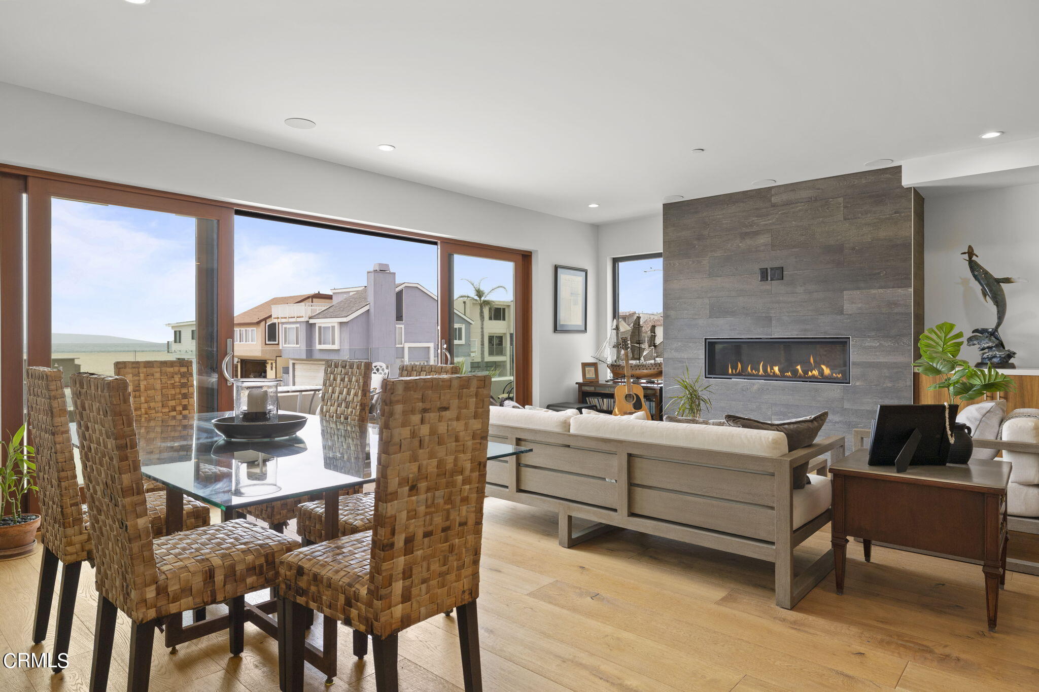 124 Ocean Drive Oxnard, CA 93035 - Photo 4 of 53 a living room with fireplace furniture and a large window