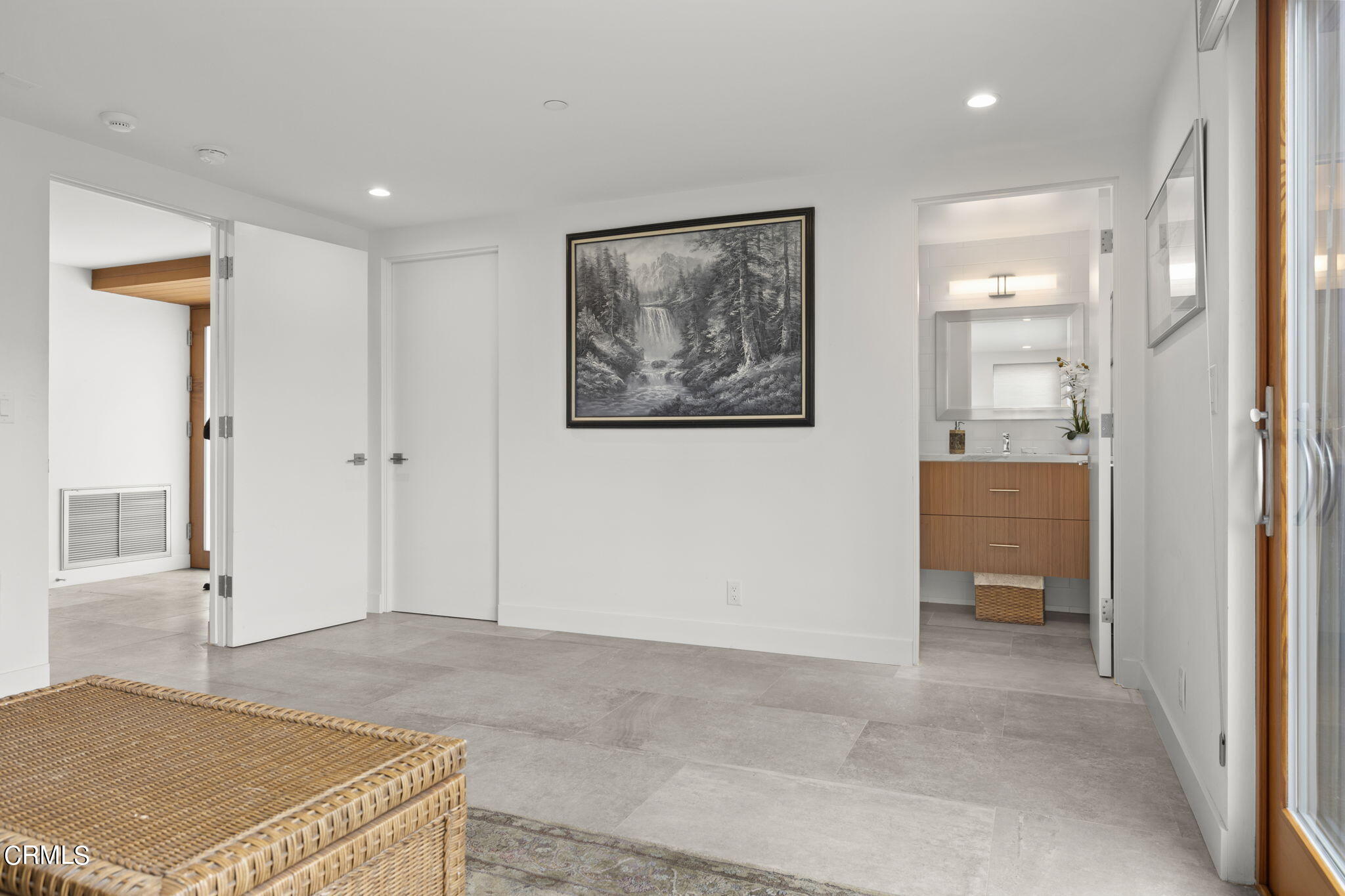124 Ocean Drive Oxnard, CA 93035 - Photo 41 of 53 a view of a hallway with wooden floor and a bathroom